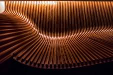 Curves are not simple 2D curves. They are complex 3D affairs, made even more difficult by rolling back bevels that had to be cut into each walnut stave to fit against the background walnut field